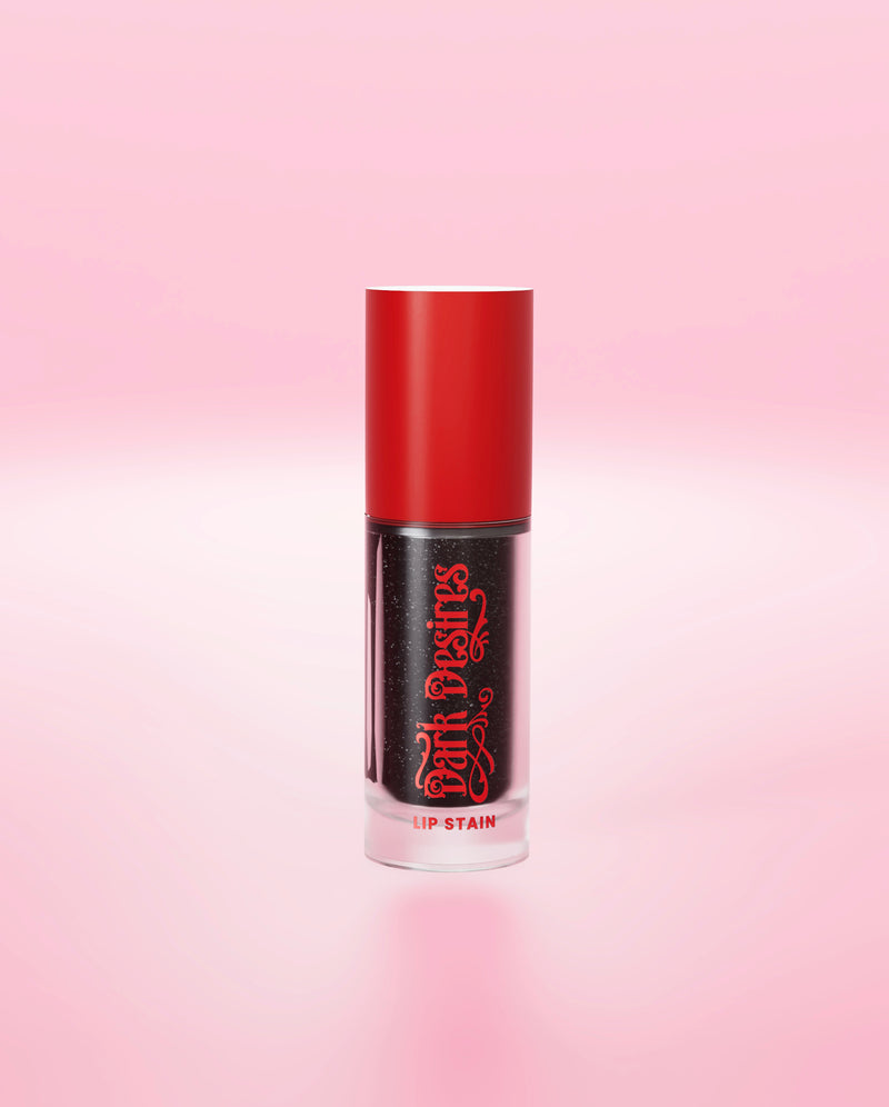 A black P.Louise colour-changing lip stain with red cap on a pink background