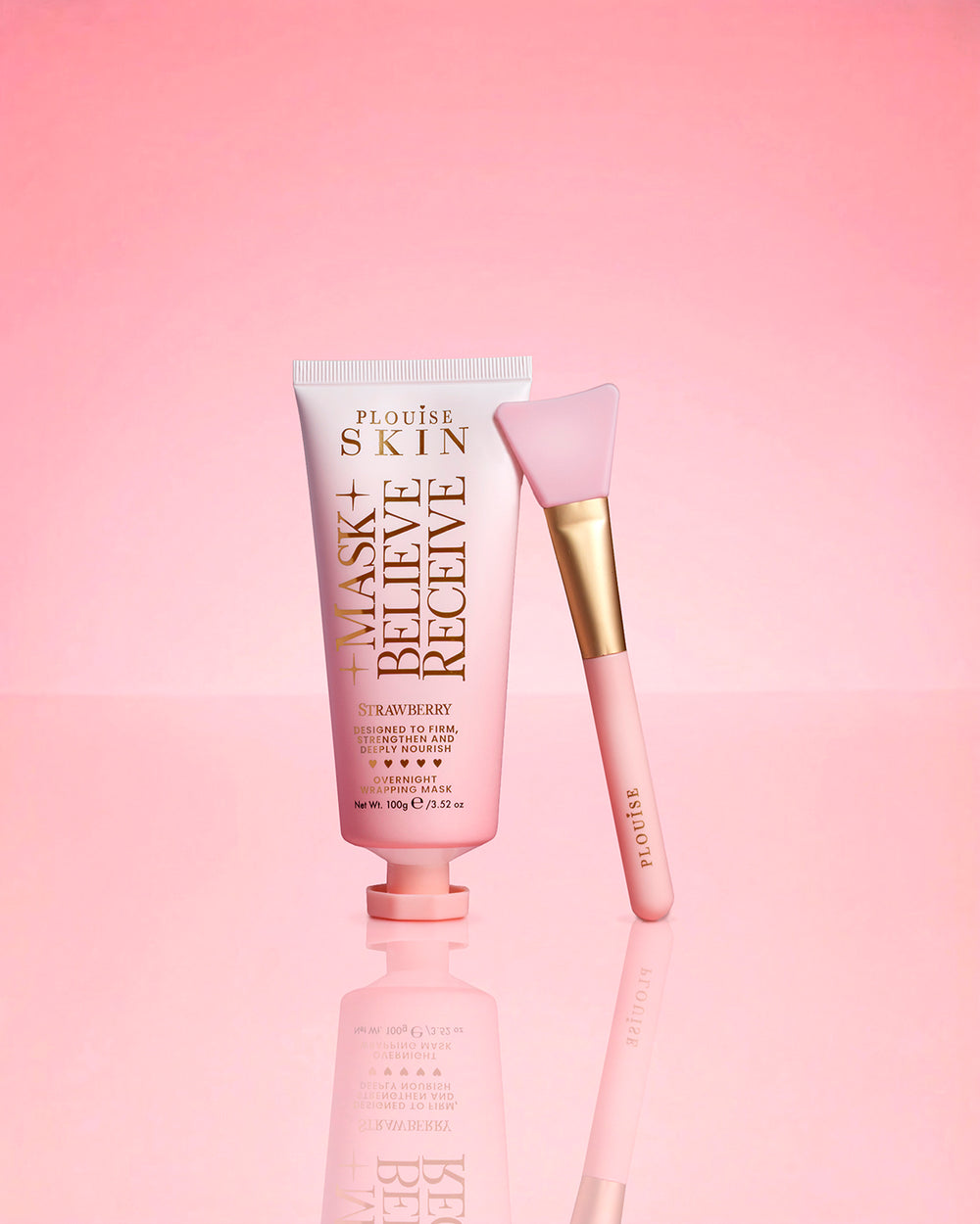 P.Louise Strawberry Overnight Wrapping Mask Mask Believe Receive on a pink background