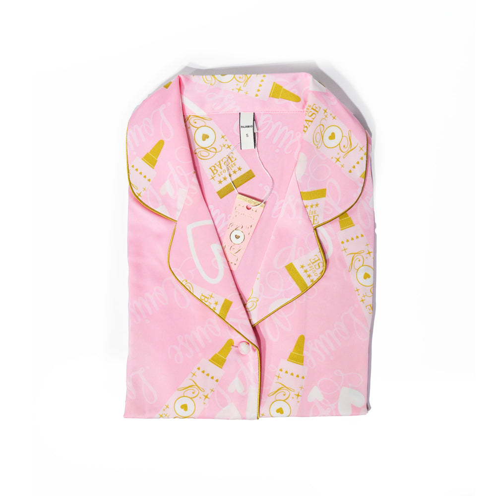 P.Louise kids pink pyjamas with a gold P.Louise base-themed design